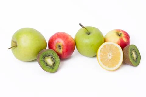 Fruits in a composition on a white background. Lemon with apples and kiwi on Foto stock