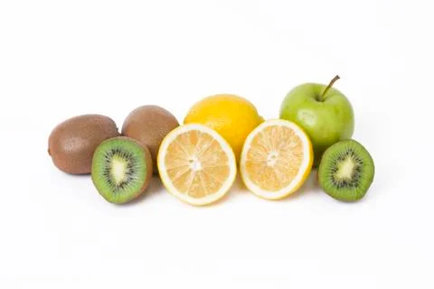 Fruits in a composition on a white background. Lemon with apples and kiwi on Stock Photos