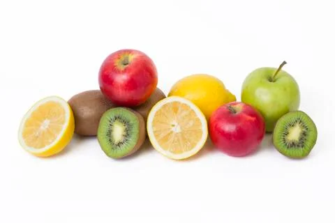 Fruits in a composition on a white background. Lemon with apples and kiwi on Stock Photos