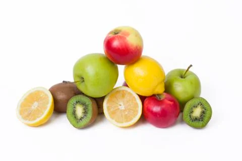 Fruits in a composition on a white background. Lemon with apples and kiwi on Stock Photos
