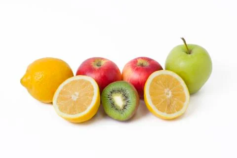 Fruits in a composition on a white background. Lemon with apples and kiwi on Stock Photos