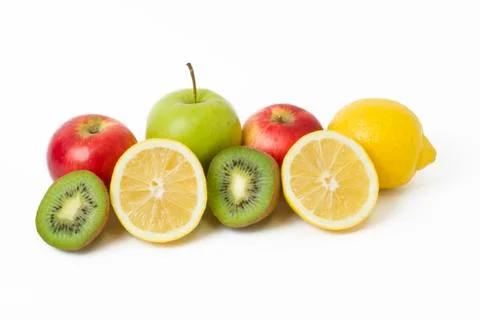 Fruits in a composition on a white background. Lemon with apples and kiwi on Stock Photos