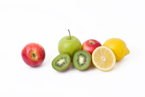 Fruits in a composition on a white background. Lemon with apples and kiwi on Foto stock