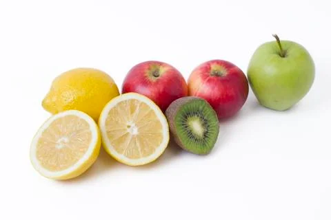 Fruits in a composition on a white background. Lemon with apples and kiwi on 스톡 사진