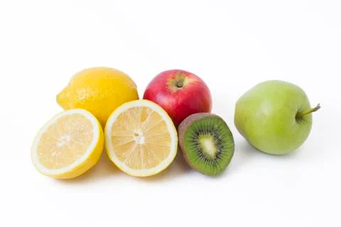 Fruits in a composition on a white background. Lemon with apples and kiwi on Stock Photos