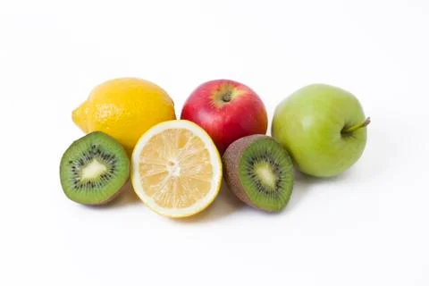 Fruits in a composition on a white background. Lemon with apples and kiwi on Stock Photos