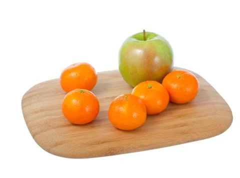 Fruits on cutting board. Stock Photos