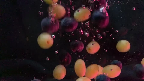 Fruits fall into the water close up Stock Footage 301176057