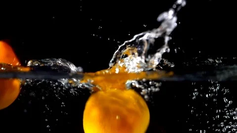 Fruits falling in slow motion against black background - 03 Stock Footage 109541773