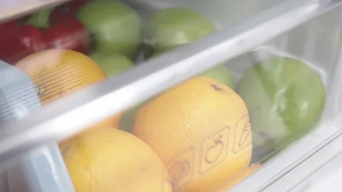 Fruits in fridge in slow motion Stock Footage 73390715