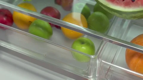 Fruits in fridge in slow motion Stock Footage 73390865