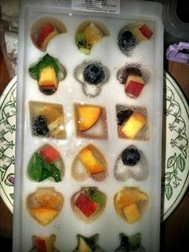 Fruits on ice. Stock Photos