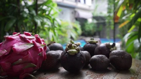 Fruits lie on a table in the background pool dragon fruit, mangosteen 库存影片 126968373