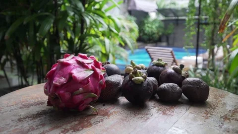 Fruits lie on a table in the background pool dragon fruit, mangosteen 库存影片 126968519