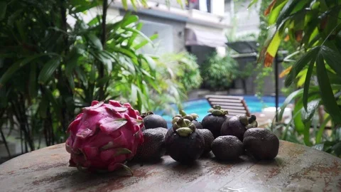 Fruits lie on a table in the background pool dragon fruit, mangosteen 库存影片 126968745