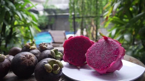 Fruits lie on a table in the background pool dragon fruit, mangosteen 库存影片 126969338