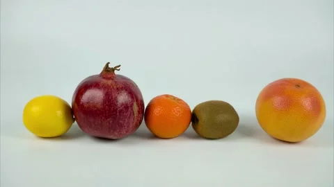 Fruits moving in a row on white background. Stop motion Stock Footage 146208177