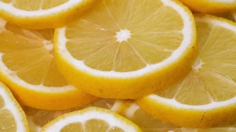 Fruits pattern, close shot. Yellow lemon slices structure. Closeup of a del.. Stock Footage 265841601