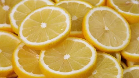 Fruits pattern, close shot. Yellow lemon slices structure. Closeup of a Stock-Footage 336588969