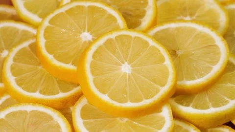 Fruits pattern, close shot. Yellow lemon slices structure. Closeup of a Stock-Footage 336588970