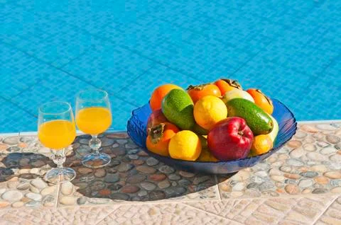 Fruits at poolside Stock Photos