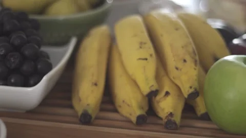 Fruits prepared on the breakfast table. Bananas, apples, breads, sandwiches. Stock Footage 216191281