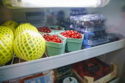 Fruits in a refrigerator Stock Photos