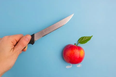 Fruits scared of a knife Stock Photos