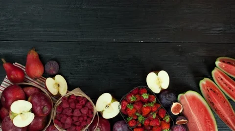 Fruits stop motion animation copy space 4k intro video food background black red Stock Footage 68458671