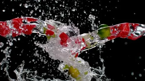 Fruits in the streams of water from both sides Stock Photos