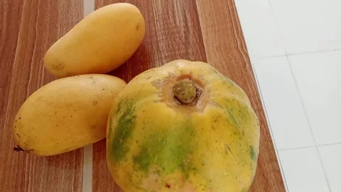 Fruits on the table, papaya and mango Stock Footage 328991635