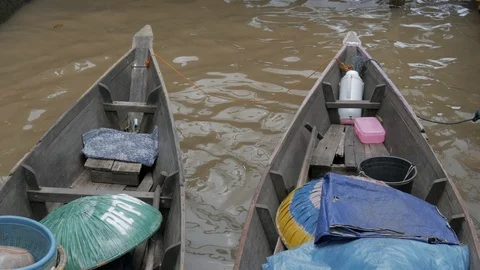 Fruits traders' rowboats decked on the floating market. 4K UHD Stock Footage 105925330