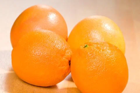 Fruits two oranges and two grapefruits Stock Photos