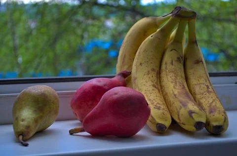 Fruits on windowsill Stock Photos