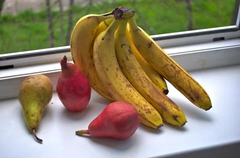 Fruits on windowsill Stock Photos