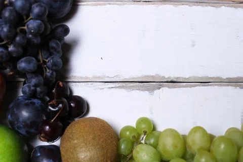 Fruits on a wooden table Stock Photos