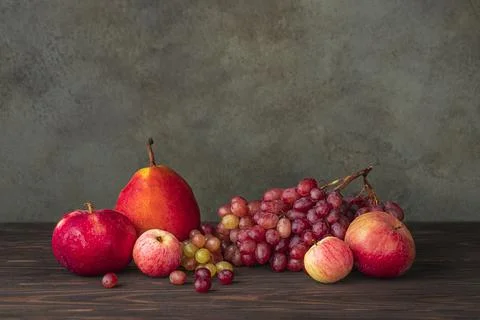 Fruits at the wooden table. Stock Photos