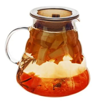 Fruity apple tea in teapot isolated on white background. Stock Photos