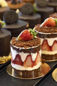 Fruity cake. Small cakes on display at the patisserie counter Stock Photos