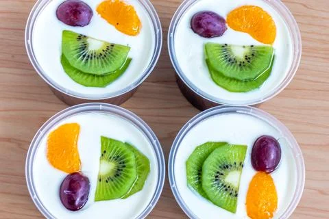 Fruity milk pudding, sweet chocolate silk pudding dessert with fruit topping Stock Photos