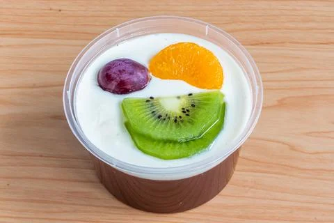 Fruity milk pudding, sweet chocolate silk pudding dessert with fruit topping Stock Photos