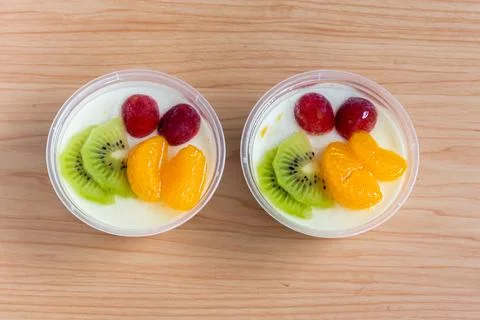 Fruity milk pudding, sweet vanilla silk pudding dessert with fruit topping Stock Photos