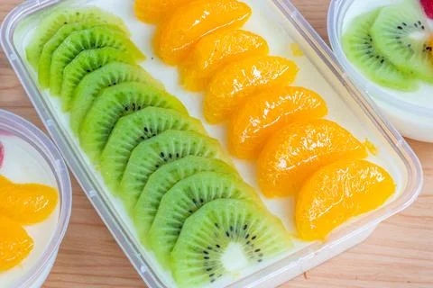 Fruity milk pudding, sweet vanilla silk pudding dessert with fruit topping Stock Photos