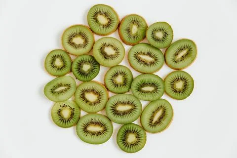 Fruity pattern of kiwi and slices on the white background.  Food concept. F.. Stock Photos