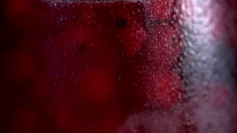 Fruity red cocktail Extreme Close up  Berries swirling in a glass in HD Stock Footage 175740850