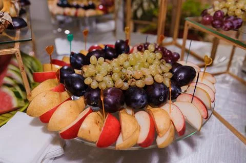 Fruity-sweet wedding reception. pineapple grapes apple Stock Photos
