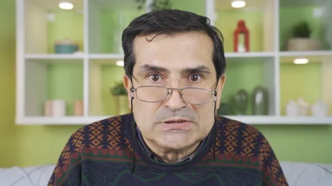 Frustrated and angry middle-aged man is overwhelmed and crazy at home. 스톡 동영상 234111201
