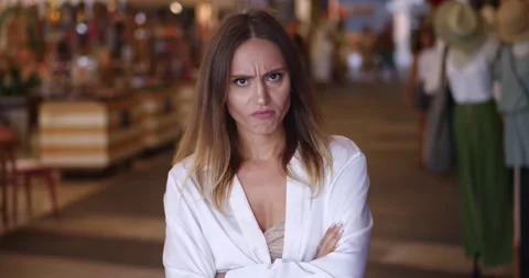 Frustrated anxious young brunette multi-ethnic woman in casual wear and white Stock Footage 220874015