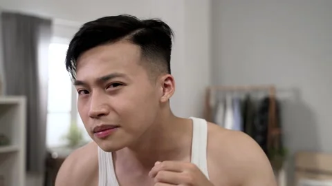 Frustrated asian man looking at camera as mirror Video stock 197367673