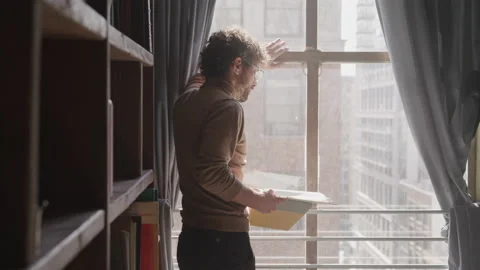 Frustrated Author Standing at a Window i... | Stock Video | Pond5